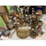 A LARGE QUANTITY OF BRASS AND COPPER ITEMS TO INCLUDE PANS, COPPER KETTLES AND STANDS, CANDLESTICKS,