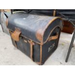 A VINTAGE LEATHER COVERED DOMED TOPPED TRAVEL TRUNK