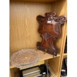 A CARVED MAHOGANY WALL MOUNTED COAT HOOK AND A GLASS CAKE PLATE