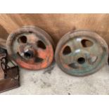 A PAIR OF VINTAGE INDUSTRIAL CAST IRON PULLEY WHEELS