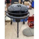 A CHARCOAL BBQ WITH TWO WHEELED BASE