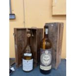 A DOUBLE MAGNUM SIZED BAROLO BOTTLE IN A WOODEN BOX PLUS A 3.75 LITRE WINE BOTTLE IN BOX BOTH