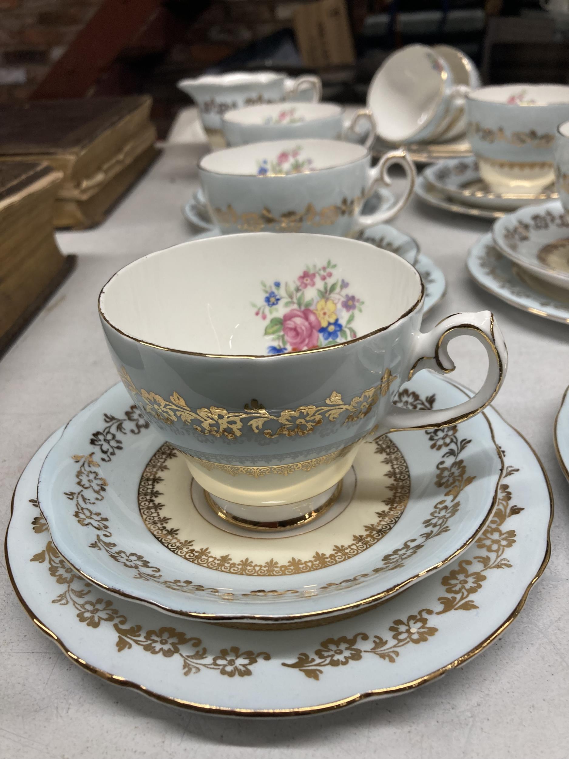 A GLADSTONE CHINA TEASET IN PALE BLUE WITH FLORAL AND GILT DECORATION TO INCLUDE CAKE PLATE, CREAM - Image 2 of 3