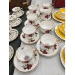 A VINTAGE ROSE PATTERNED 'LUBORN' TEASET TO INCLUDE CUPS, SAUCERS, CREAM JUG AND SUGAR BOWL