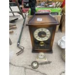 A DECORATIVE WALL CLOCK AND A FURTHER SMALL MANTLE CLOCK