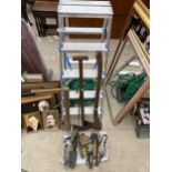 AN ASSORTMENT OF TOOLS TO INCLUDE A FOUR RUNG ALUMINIUM STEP LADDER, AN AXE AND A SLEDGE HAMMER ETC