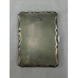 A BIRMINGHAM HALLMARKED SILVER CARD CASE HOLDER WITH LEATHER INTERIOR IN GOOD CONDITION AND
