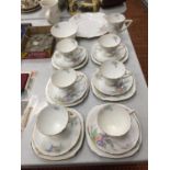 A VINTAGE ROYAL STAFFORD TEASET TO INCLUDE A SANDWICH PLATE, CUPS, SAUCERS, SIDE PLATES, CREAM JUG