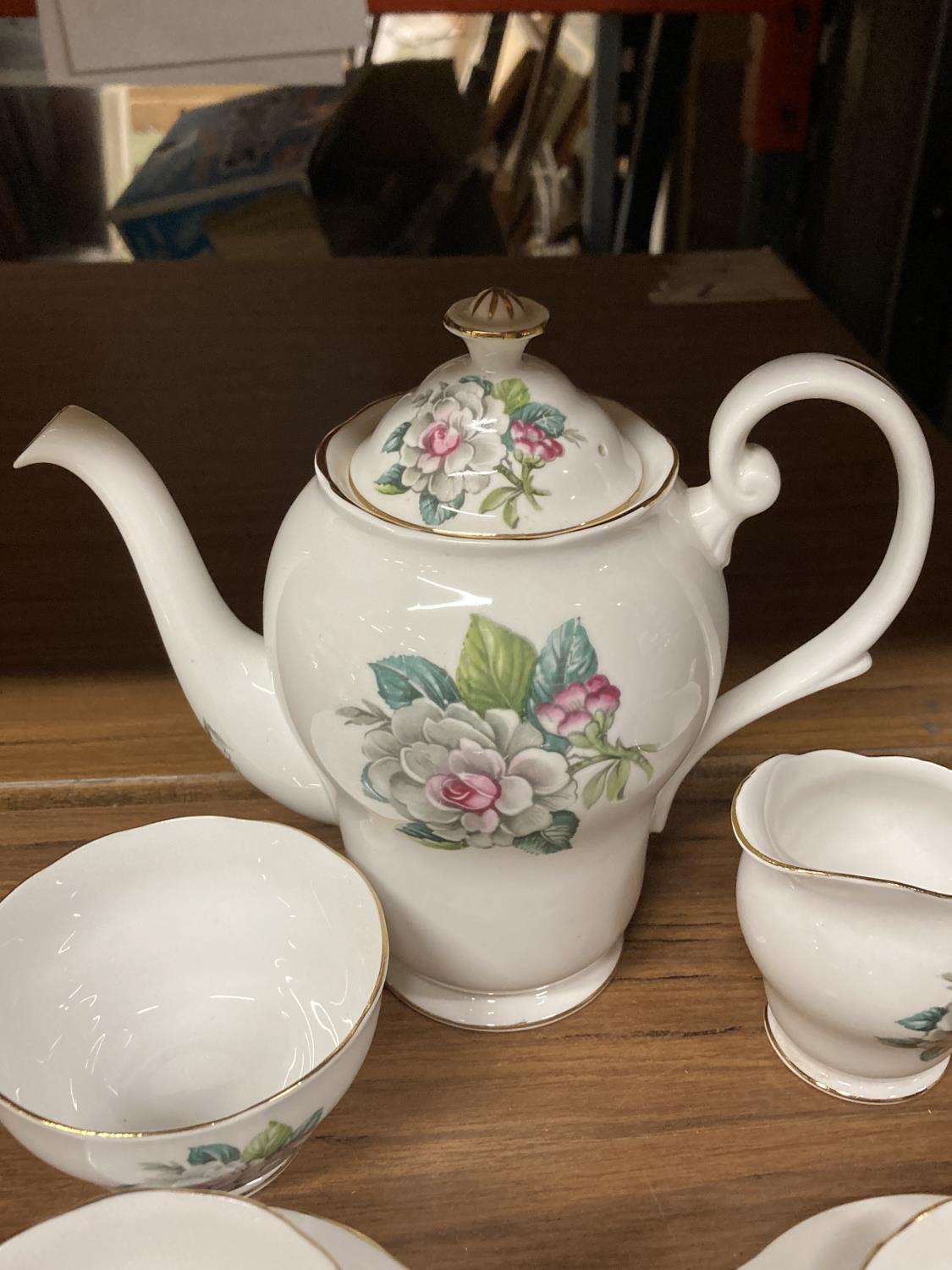 A BONE CHINA COFFEE SET WITH FLORAL DECORATION TO INCLUDE COFFEE SET, CREAM JUG, SUGAR BOWL, CUPS - Image 5 of 6