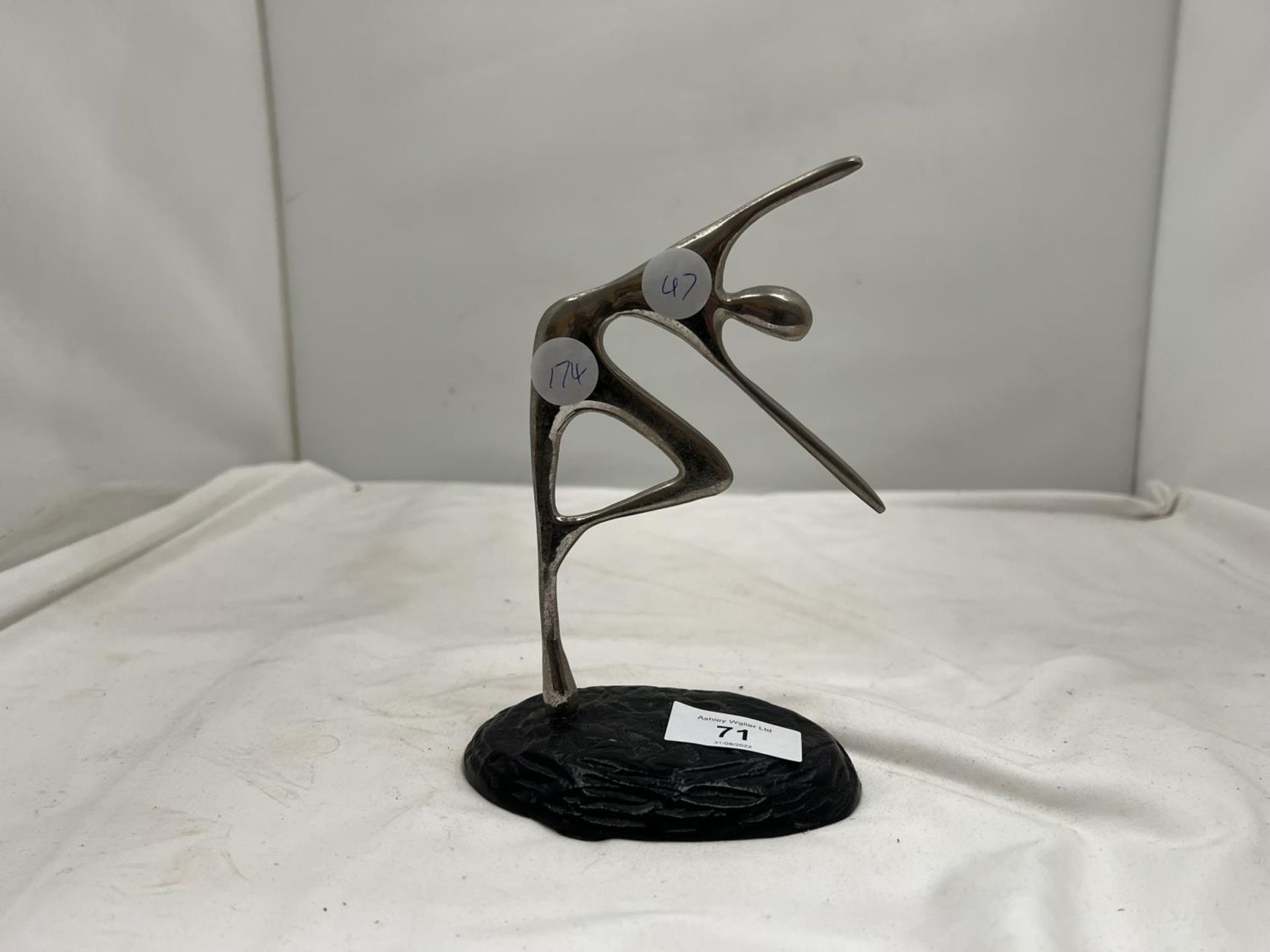 A METALWARE SCULPTURE OF A FIGURE DANCING HEIGHT 18CM