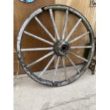 A VINTAGE WOODEN CART WHEEL WITH CAST IRON BANDING (D:170CM)