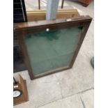 A WOODEN GLAZED DISPLAY CABINET