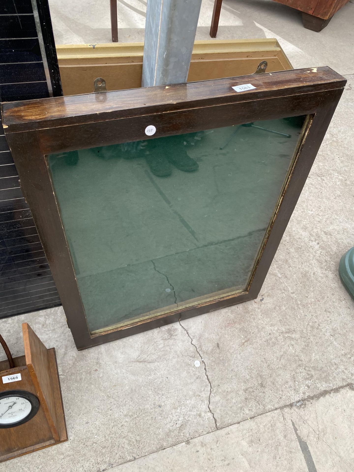 A WOODEN GLAZED DISPLAY CABINET