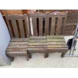 A SET OF THREE WOODEN SLATTED GARDEN CHAIRS