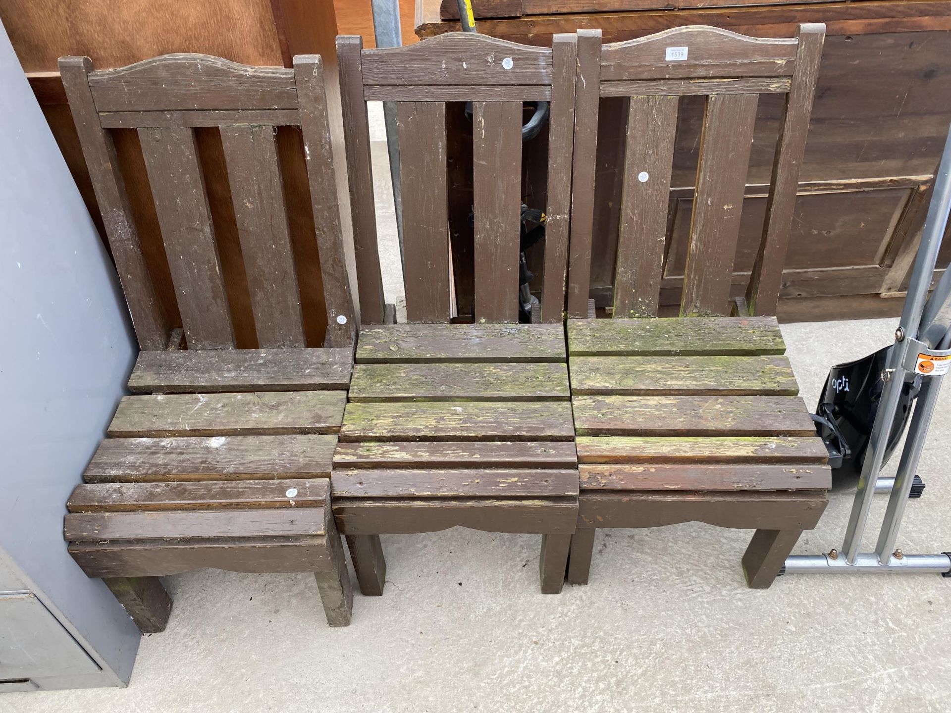A SET OF THREE WOODEN SLATTED GARDEN CHAIRS