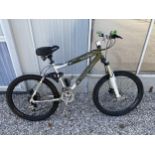 A SILVERFOX KNARLY MOUNTAIN BIKE WITH FRONT SUSPENSION AND 24 SPEED GEAR SYSTEM