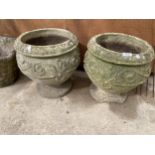 A PAIR OF RECONSTITUTED STONE PLANTERS