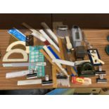 A QUANTITY OF STATIONERY ITEMS TO INCLUDE RULERS, BULLDOG CLIPS, PROTRACTORS, STAPLERS, TABLE TOP