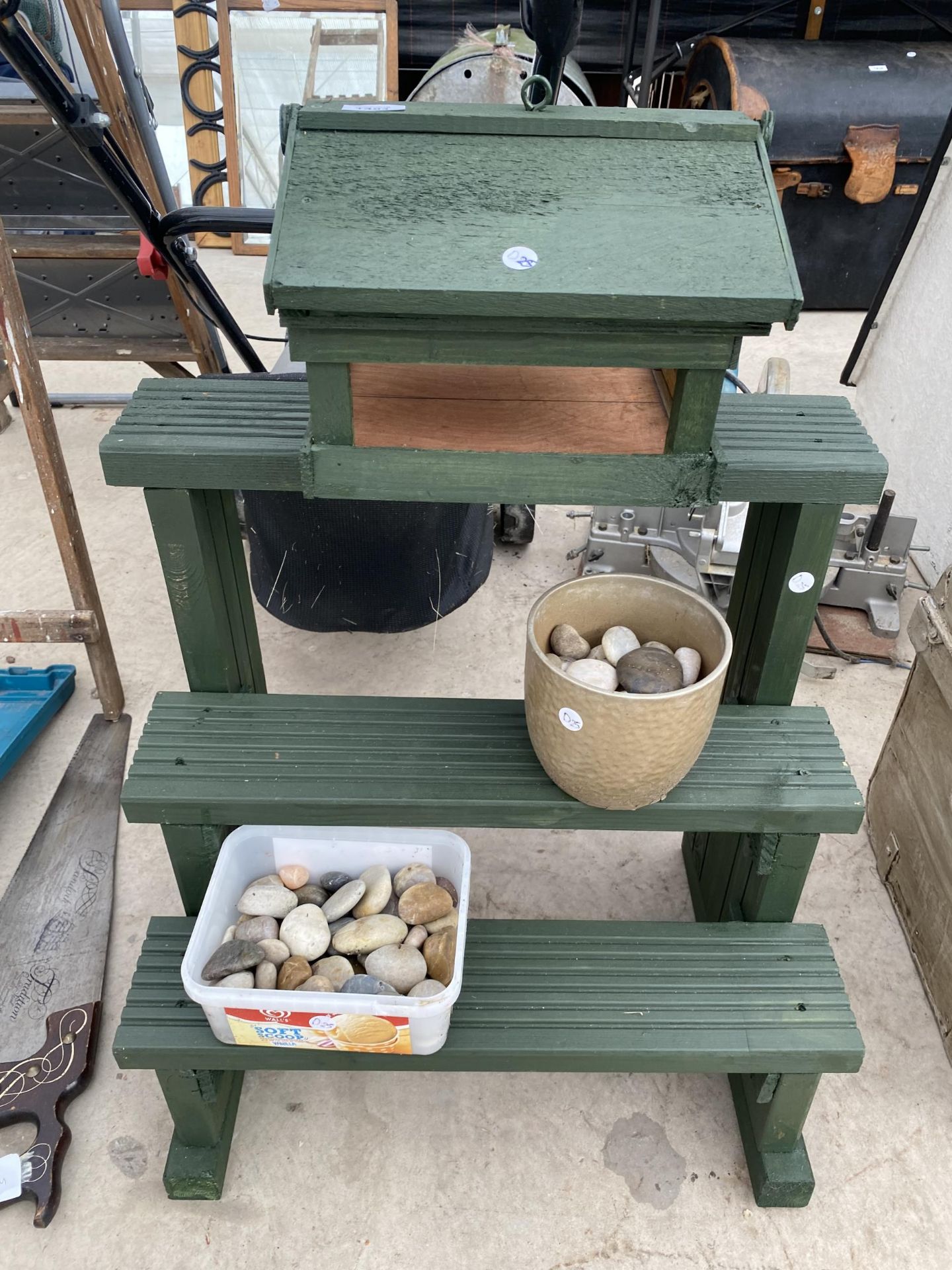 A WOODEN BIRD TABLE TOP, A WOODEN DISPLAY STAND AND AND ASSORTMENT OF PEBBLES