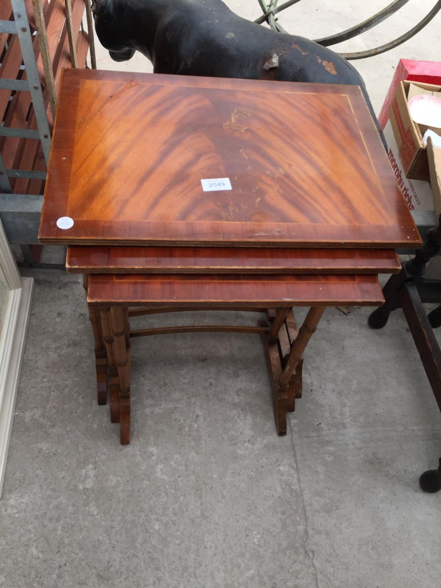 A NEST OF THREE MAHOGANY TABLES