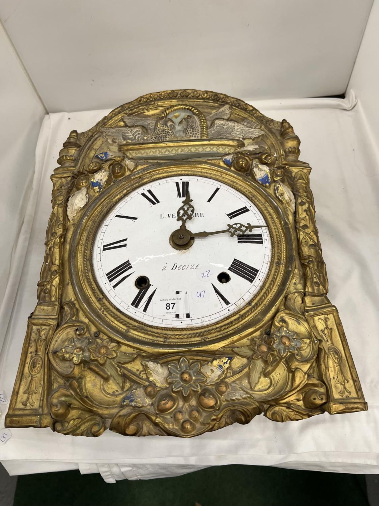 A FRENCH WALL CLOCK WITH A CERAMIC DIAL IN NEED OF RESTORATION