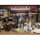 A LARGE QUANTITY OF ANIMAL FIGURINES TO INCLUDE CATS, DOGS, PIGS, BULLS, ETC