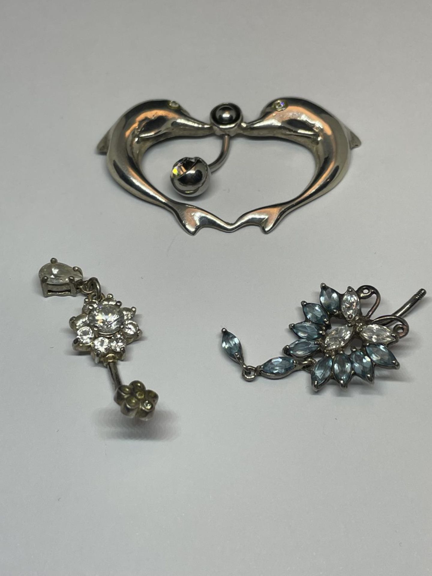 THREE SILVER BELLY BUTTON BARS