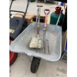 A METAL WHEEL BARROW, A FORK AND A SHOVEL