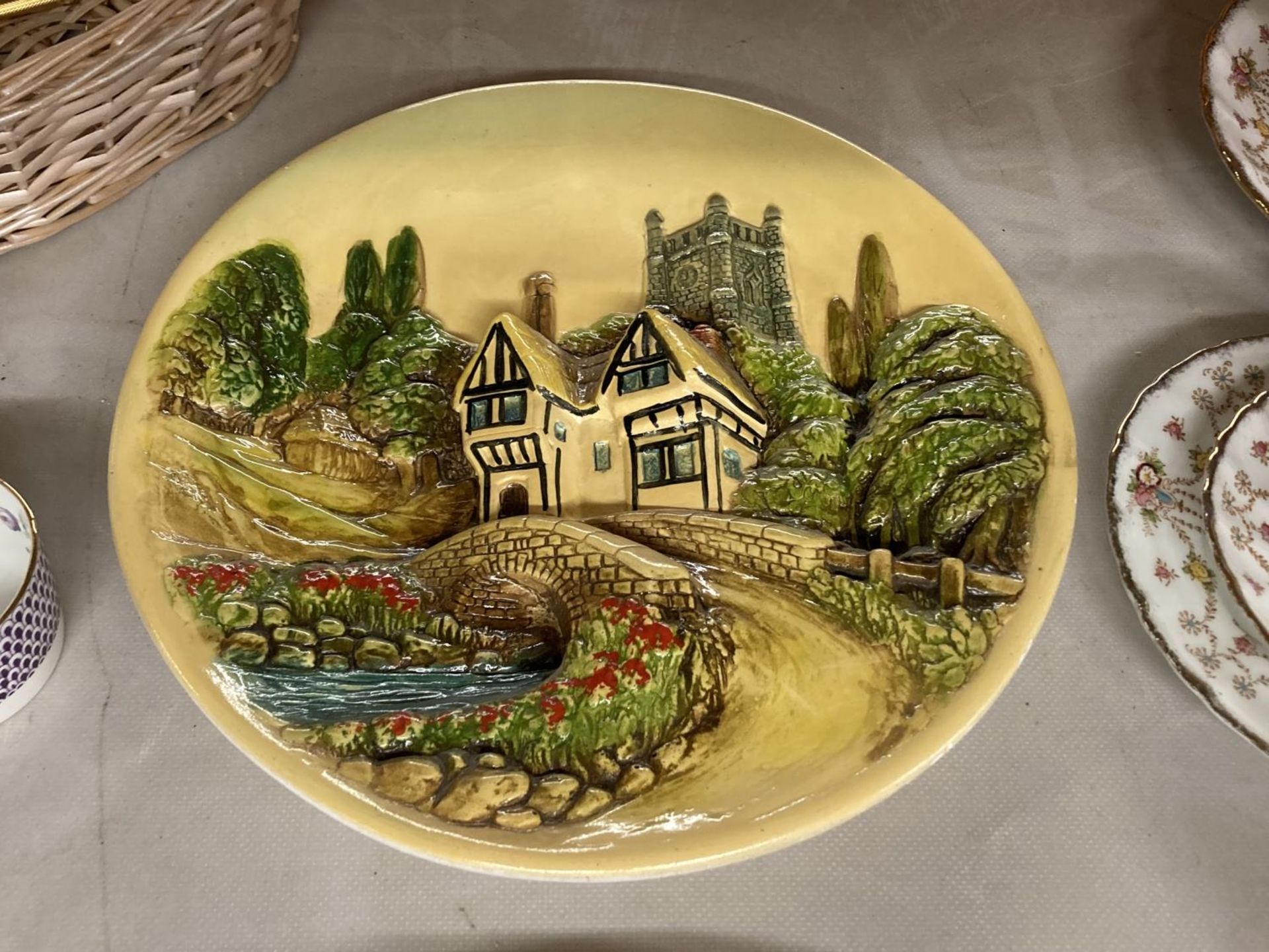 TWO CERAMIC 3-D WALL PLAQUES WITH SCENES OF RURAL VILLAGES - Image 3 of 3