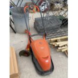 A FLYMO ELECTRIC LAWN MOWER AND AN ELECTRIC GRASS STRIMMER