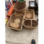 AN ASSORTMENT OF WICKER BASKETS TO INCLUDE A LAUNDRY BASKET AND A FRUIT BASKET ETC