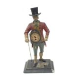 A VINTAGE CAST ALLOY FIGURE OF A DUTCH CLOCK SELLER H: 40CM