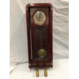 AN ART NOUVEAU STYLE MAHOGANY CASED WALL CLOCK WITH BRASS AND SILVERED DIAL