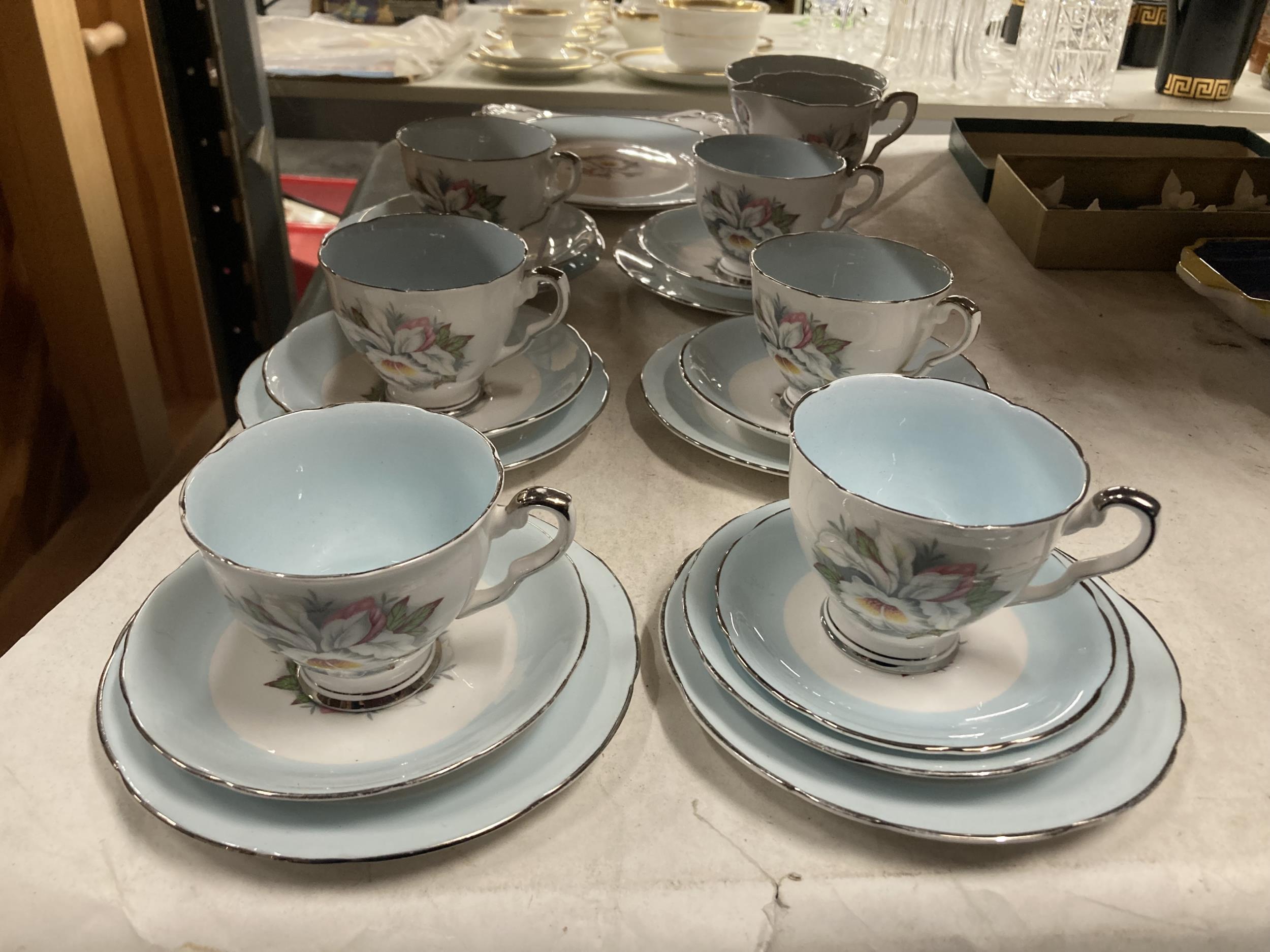 A ROYAL STAFFORD 'WHITE LADY' TEASET TO INCLUDE A CAKE PLATE, CUPS, SAUCERS, SIDE PLATES, CREAM