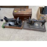 A VINTAGE JONES SEWING MACHINE WITH WOODEN CARRY CASE AND A VINTAGE SINGER SEWING MACHINE
