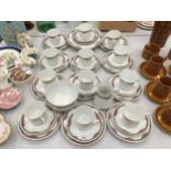 A LARGE QUANTITY OF TEAWARE TO INCLUDE CUPS, SAUCERS, PLATES, CREAM JUG AND SUGAR BOWL