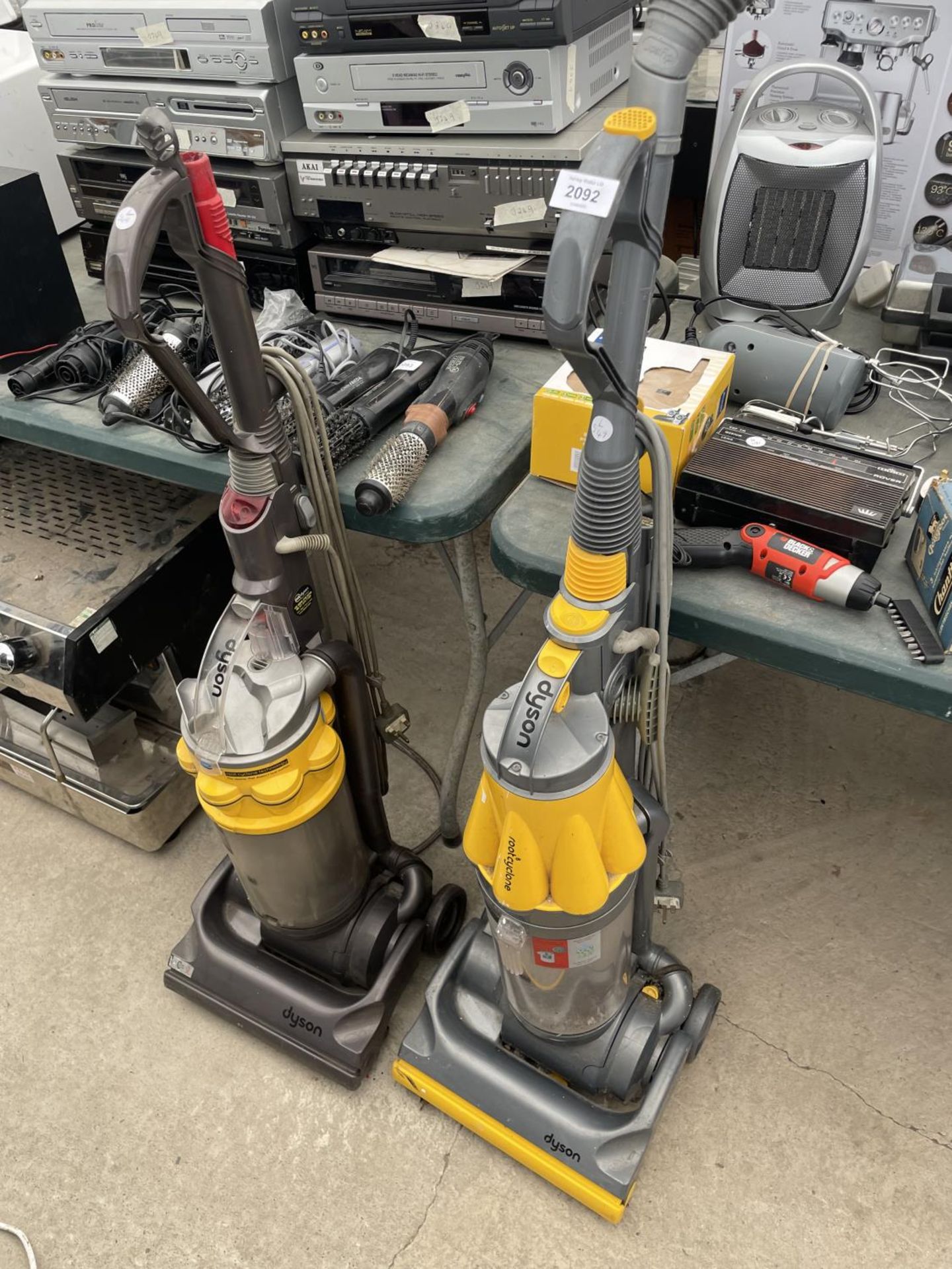 A DYSON DC07 AND A DYSON DC14 VACUUM CLEANERS