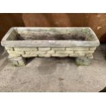 A RECONSTITUTED STONE TROUGH PLANTER