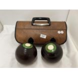 A PAIR OF J B YOUNG WOODEN BOWLS IN A CASE