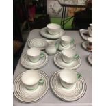 A WEDGWOOD BONE CHINA TEASET IN A SILVER AND GREEN COLOURED CIRCULAR DESIGN TO INCLUDE CAKE PLATES