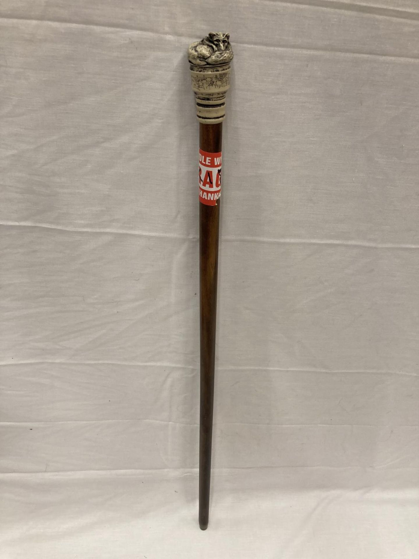 A WALKING CANE WITH A FOX FINIAL AND ENGRAVED HUNTING SCENE
