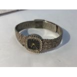 A LADIES FASHION WRIST WATCH SEEN WORKING BUT NO WARRANTY GIVEN