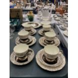 A VINTAGE BONE CHINA TEASET WITH A BLACK AND GILT FLORAL PATTERN TO INCLUDE CAKE PLATE, SUGAR