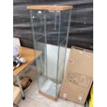 A GLASS SHOP DISPLAY CABINET
