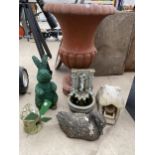 AN ASSORTMENT OF GARDEN ITEMS TO INCLUDE A PLASTIC URN PLANTER, A RECONSTITUTED STONE DUCK, A