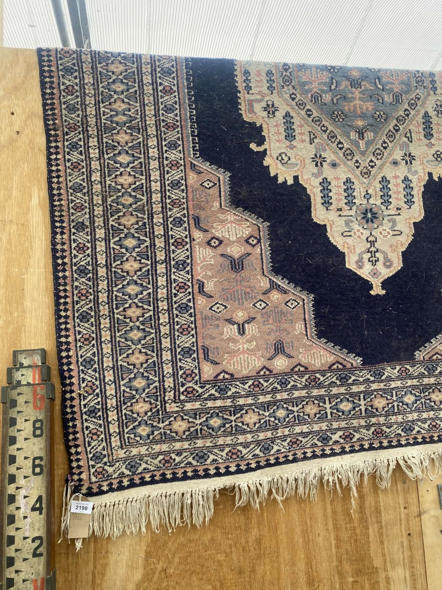 A BLUE PATTERNED FRINGED RUG - Image 2 of 3