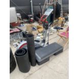 A KETTLER CROSS TRAINER MACHINE, TWO EXERCISE MATS AND A STEPPER ETC
