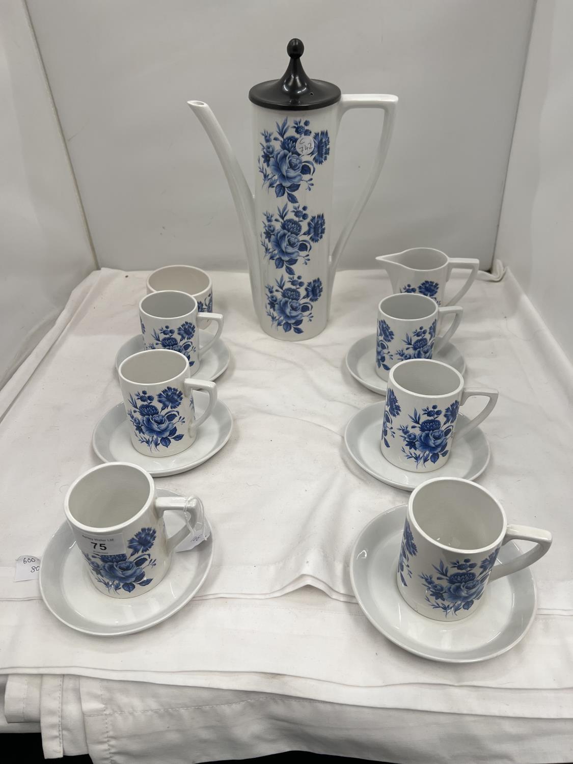 A PORTMEIRION COFFEE SET IN A BLUE AND WHITE FLORAL PATTERN TO INCLUDE COFFEE POT, SUGAR BOWL, CREAM