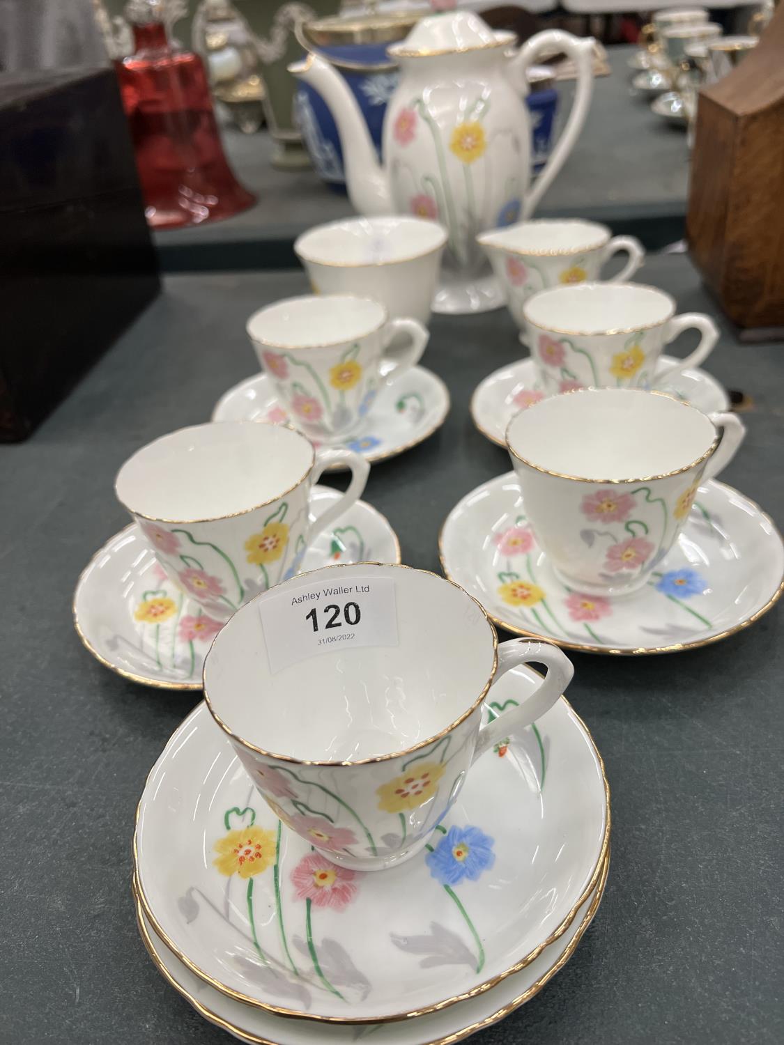 A DELPHINE CHINA TEASET TO INCLUDE A COFFEE POT, CREAM JUG, SUGAR BOWL, CUPS AND SAUCERS