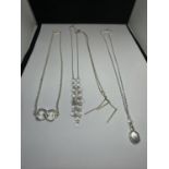 FOUR MARKED SILVER NECKLACES WITH VARIOUS DESIGN PENDANTS